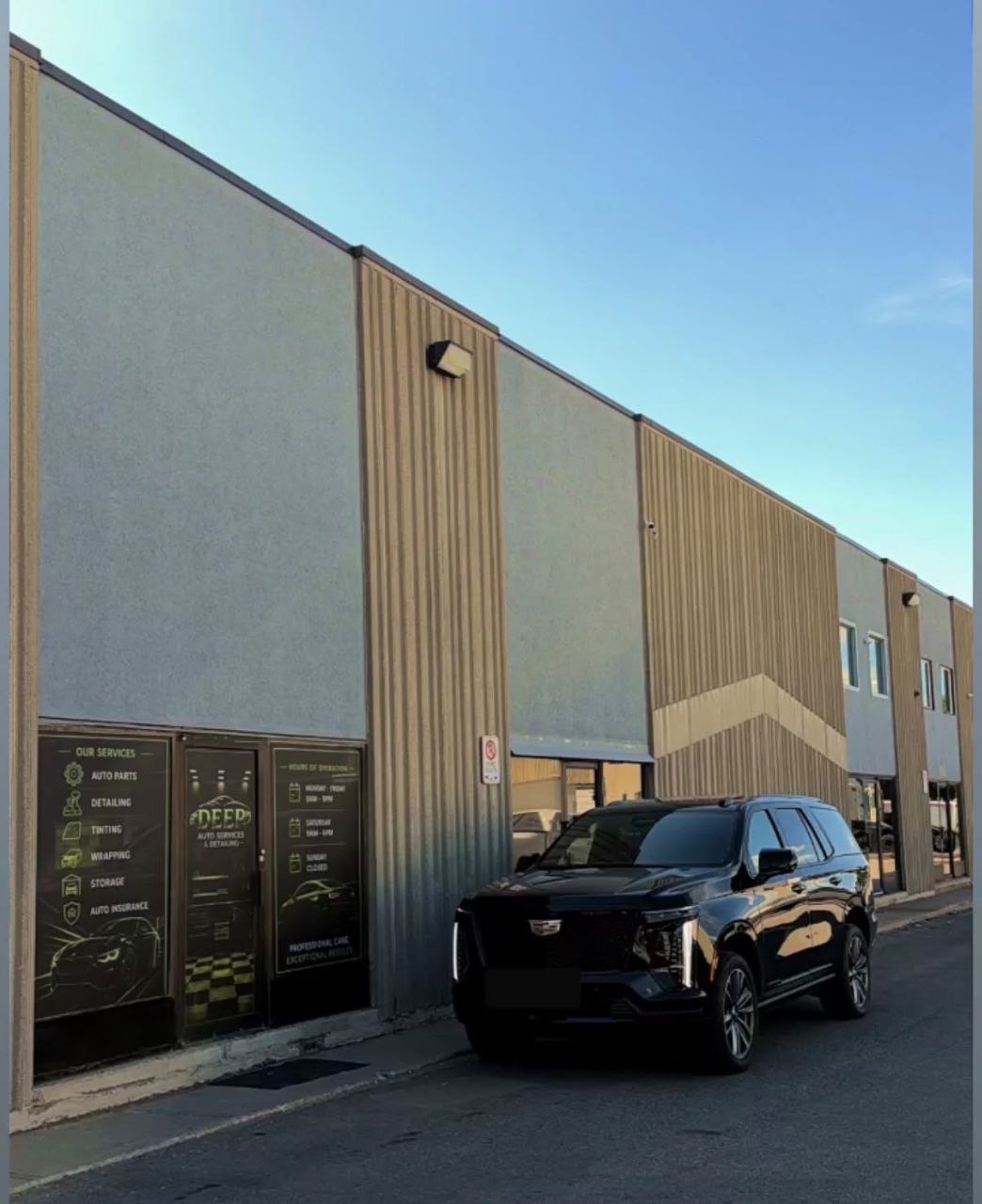 Deep Auto Service storefront with black SUV