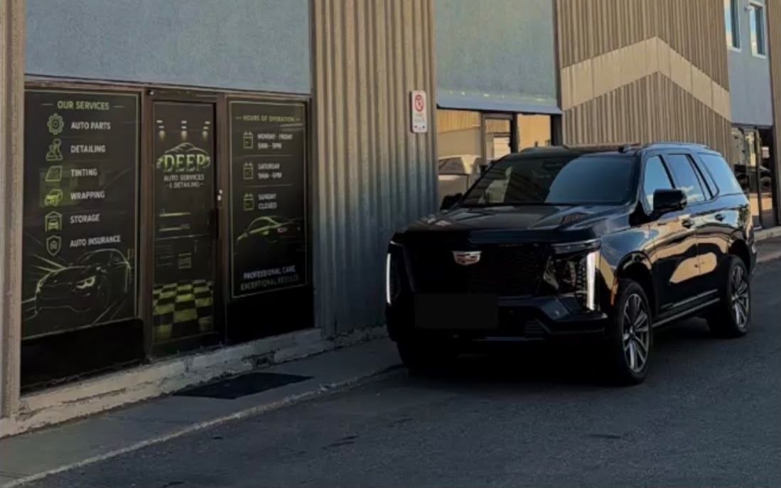 Deep Auto Service storefront with black SUV
